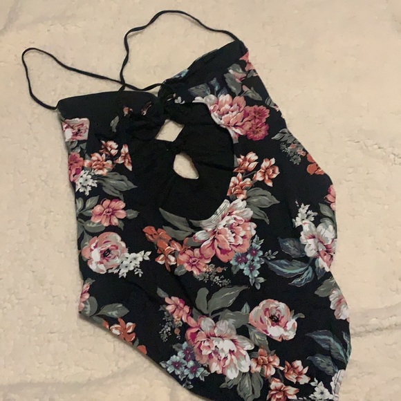 A one-piece bathing suit with a keyhole back and two little peek-a-boo holes - Picture 2 of 4